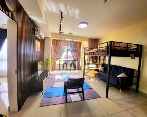a room with a bunk bed and a living room at Bali Residence Impian Raudah in Melaka