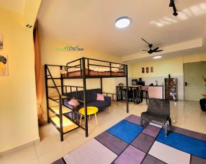 a room with a bunk bed and a living room at Bali Residence Impian Raudah in Melaka