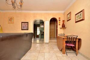a kitchen with a table and chairs and a dining room at Cosy Antibes villa in Antibes