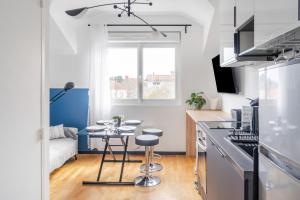 a kitchen with a small table in a kitchen at Appartement Chantenay 4 pers in Nantes