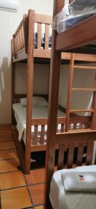 two sets of bunk beds in a room at Sos Hostel in Camaçari