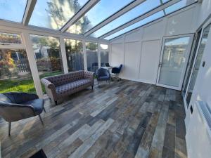 an empty room with a conservatory with glass ceiling at Elm Park Cheerful 4-Bedroom Holiday Home in Hornchurch