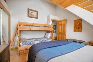 a bedroom with two bunk beds and a staircase at Ranch Home in Glenwood Springs