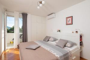 Posteľ alebo postele v izbe v ubytovaní Bounty Apartment