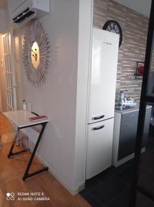 Kuchyňa alebo kuchynka v ubytovaní Le Cosy + 19 fotografií