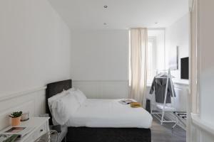 Posteľ alebo postele v izbe v ubytovaní Relais Roma Centro