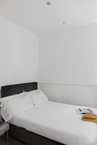 Posteľ alebo postele v izbe v ubytovaní Relais Roma Centro
