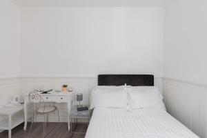 Posteľ alebo postele v izbe v ubytovaní Relais Roma Centro