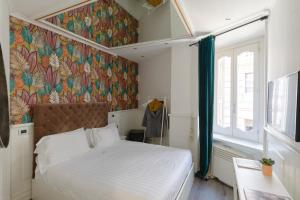 Posteľ alebo postele v izbe v ubytovaní Relais Roma Centro