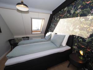 Postel nebo postele na pokoji v ubytování Hotel Workum