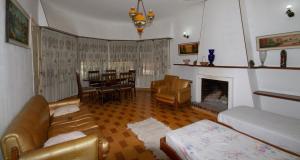 a living room with a couch and a fireplace at Residencia Morón in Morón