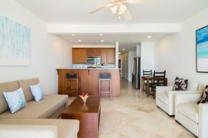 a living room with a couch and a table at New Listing La Vista Azul Spacious 1 Bedroom Condo in Turtle Cove