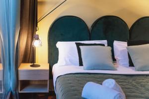 Łóżko lub łóżka w pokoju w obiekcie Italianflat - Empireo Rooms - 200mt to Arena