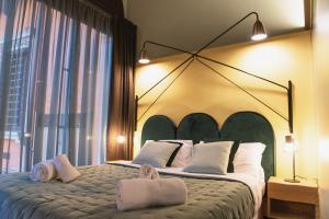 Łóżko lub łóżka w pokoju w obiekcie Italianflat - Empireo Rooms - 200mt to Arena