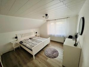 Postel nebo postele na pokoji v ubytování Ferienhaus Lotte
