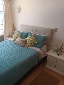 Postel nebo postele na pokoji v ubytování Departamento Frente al Mar