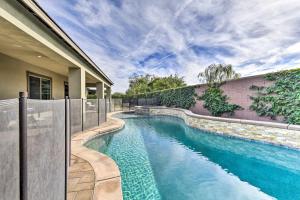 a swimming pool in the backyard of a house at Elegant Indio Home with Private Pool and Spa! in Indio