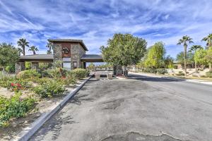 a house on the side of a road at Elegant Indio Home with Private Pool and Spa! in Indio