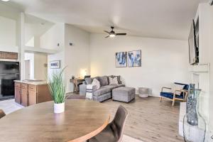 a living room with a table and a couch at Family-Friendly Getaway Community Amenities! in Bakersfield