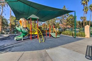 a playground with a slide in a park at Family-Friendly Getaway Community Amenities! in Bakersfield