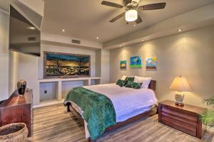 a bedroom with a bed and a ceiling fan at Lavish Family Escape with Game Room in Avondale! in Avondale +35 photos