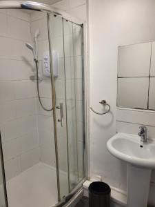a bathroom with a shower and a sink at Entire Flat city centre based. in Parkside