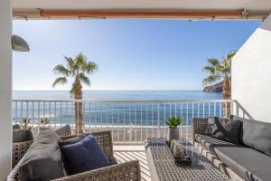 a living room with a view of the ocean at Modern luxury beach Penthouse in La Herradura