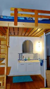 a bathroom with a sink and a bunk bed at Private Gästezimmer bei Ila Zimmerling in Dresden