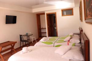 Postel nebo postele na pokoji v ubytování La Gran Estancia Hotel Campestre