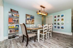 a dining room with a table and chairs at Chelsea Lake House, Game Room, & Pontoon-rental in Chelsea