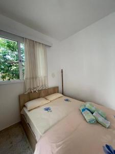 two twin beds in a bedroom with a window at Grandmother's House in Famagusta