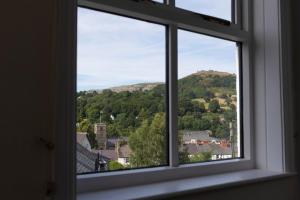 a window with a view of a mountain at 1 Bodwen Villas in Llangollen
