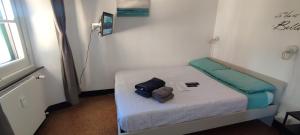 a small room with a bed in a room at Genova Rooms Brignole B in Genoa +4 photos