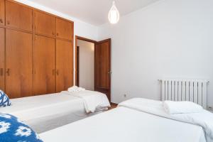 A bed or beds in a room at ES GANXO HOUSE PORTO CRISTO
