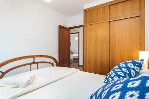 A bed or beds in a room at ES GANXO HOUSE PORTO CRISTO