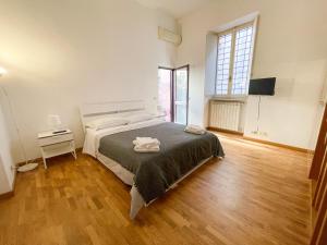 Posteľ alebo postele v izbe v ubytovaní La Pigna Boutique Apartment