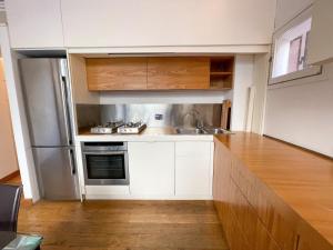 Kuchyňa alebo kuchynka v ubytovaní La Pigna Boutique Apartment