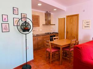 a kitchen and dining room with a table and chairs at Casa Alma in Almería