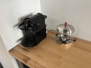 a kitchen counter with a toaster and a mixer at Atelier 84 - AC - Loft - Avignon Centre Ville in Avignon