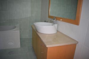a bathroom with a sink and a toilet at Vila Oceânica 2 in Buarcos +46 photos