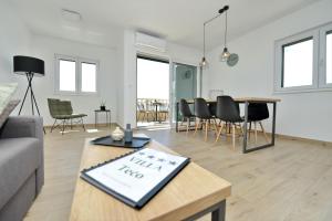 Posedenie v ubytovaní Villa Tećo - Moderne Apartments mit Pool und Meerblick