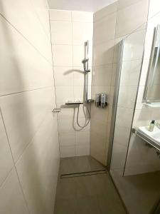 a bathroom with a shower and a sink at Haus Maria Isenburg - Naturpark Rhein-Westerwald in Isenburg