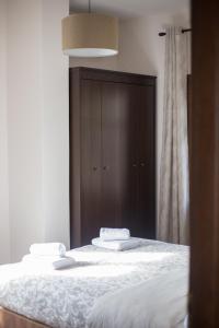 A bed or beds in a room at Μελίτη Pelion Luxury Living
