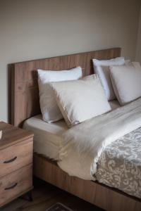 A bed or beds in a room at Μελίτη Pelion Luxury Living