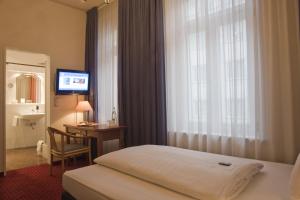 Postel nebo postele na pokoji v ubytování Hotel Fürst Bismarck
