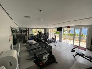 a gym with a row of treadmills and exercise bikes at Flat na Vila Olimpia rua Santa Justina in Sao Paulo