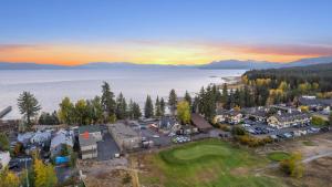 an aerial view of a resort with a lake and mountains at Mother Nature's Inn in Tahoe City