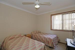 a bedroom with two beds and a window at Quarterdeck 9 in Port Macquarie