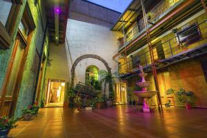 a courtyard with a fountain in a building at Hotel Parada in Buenos Aires