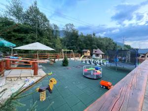 a playground with many different types of play equipment at U plechového Jánošíka in Terchová